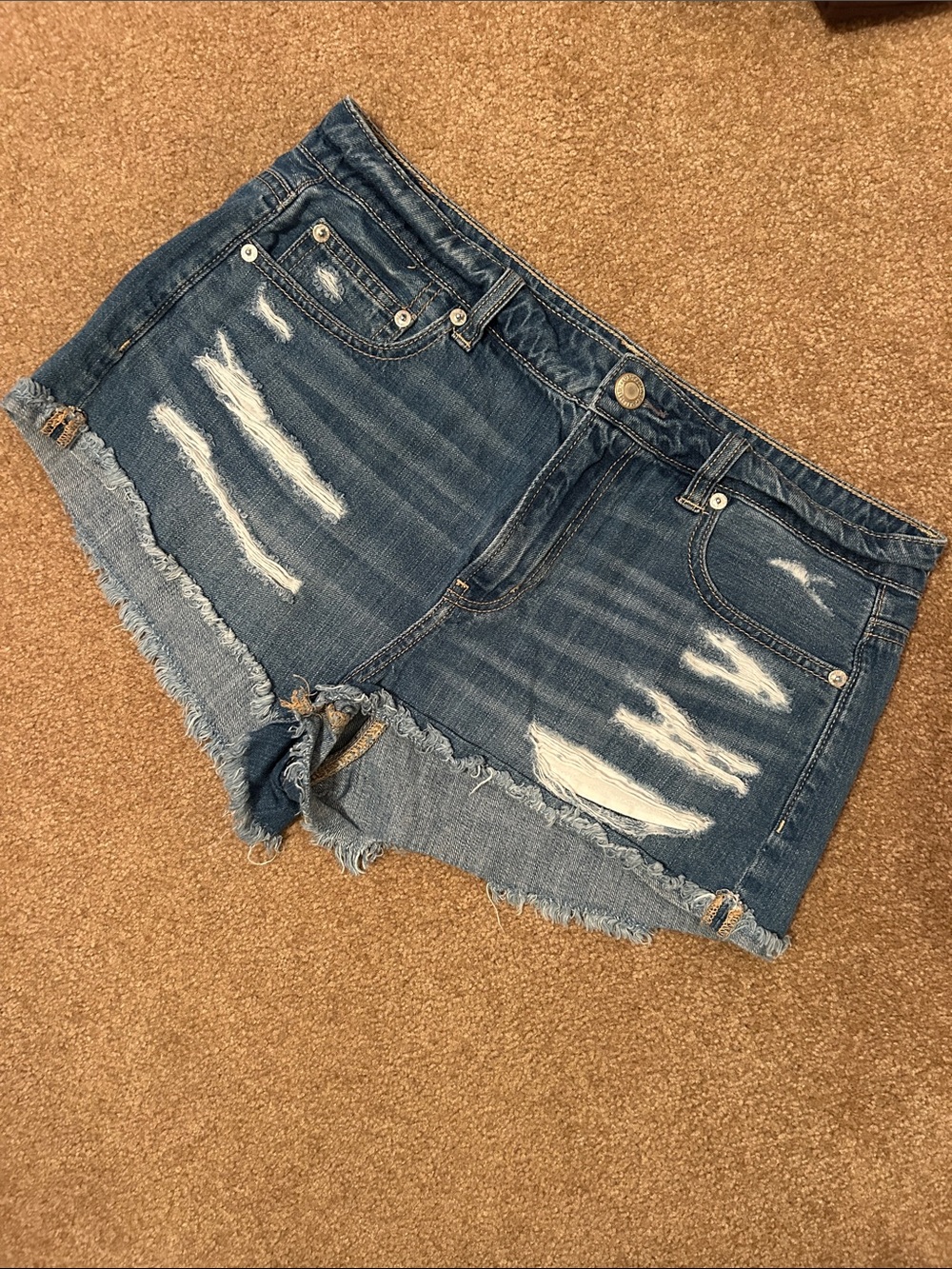 American Eagle Tomgirl Shorties distressed denim shorts